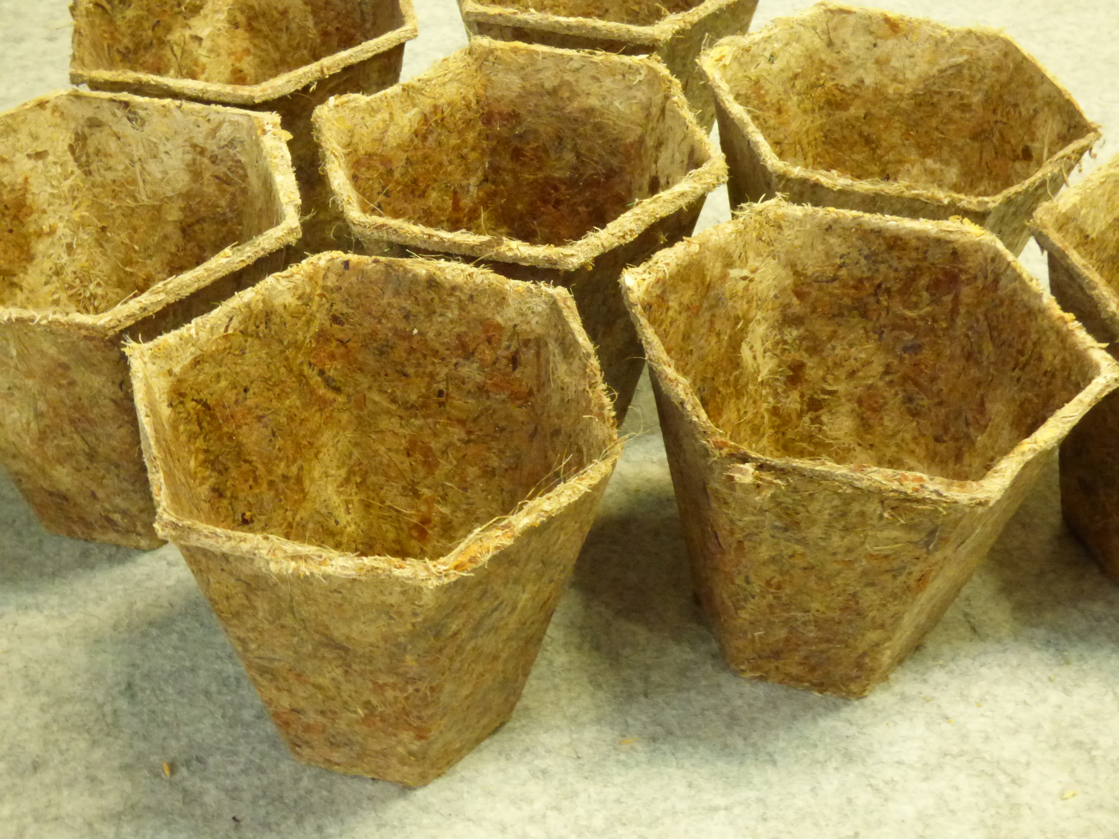 Light brown hexagonal pots made of grass and reed