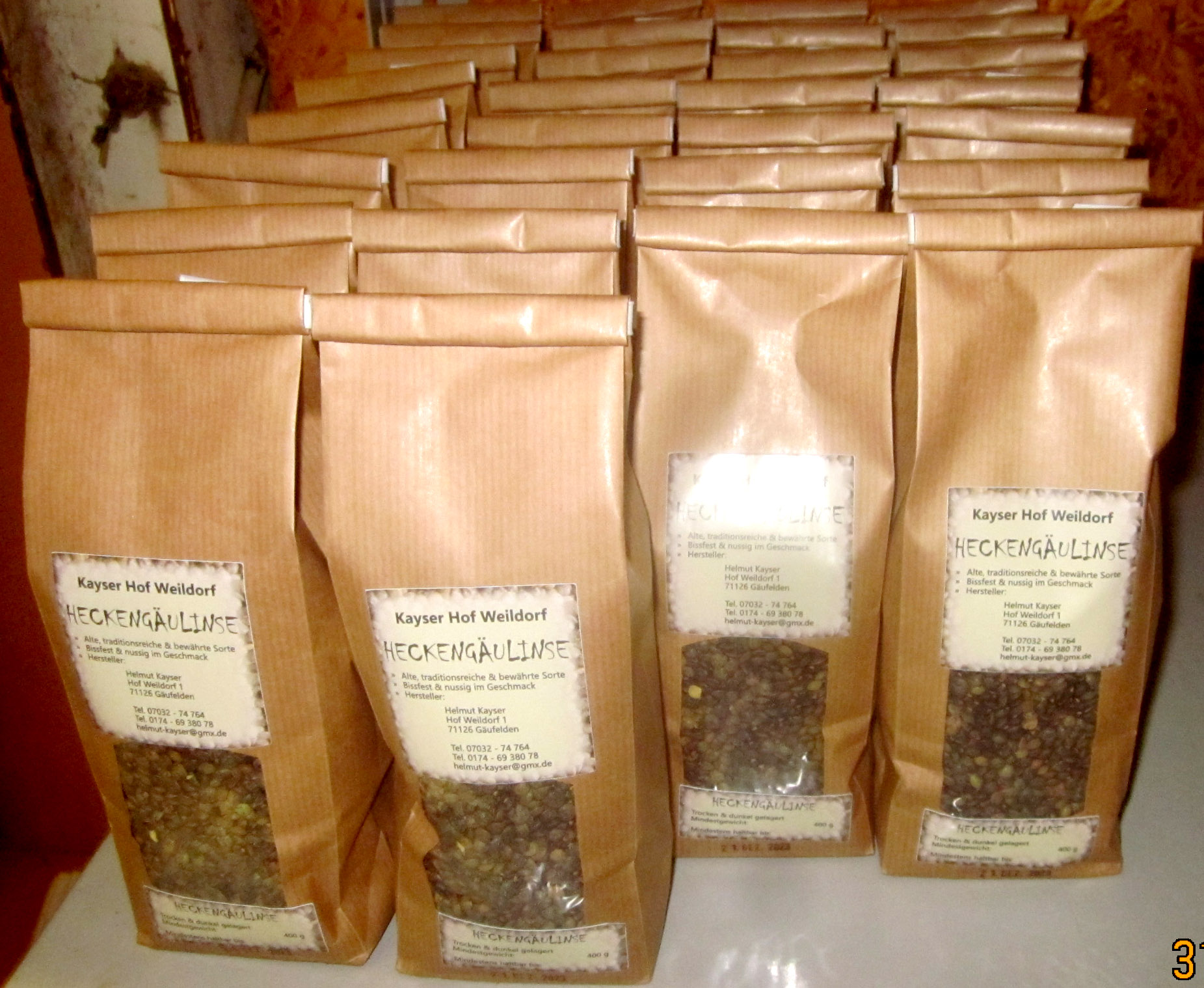 The photo shows 30 ready-filled and labelled lentil packets.