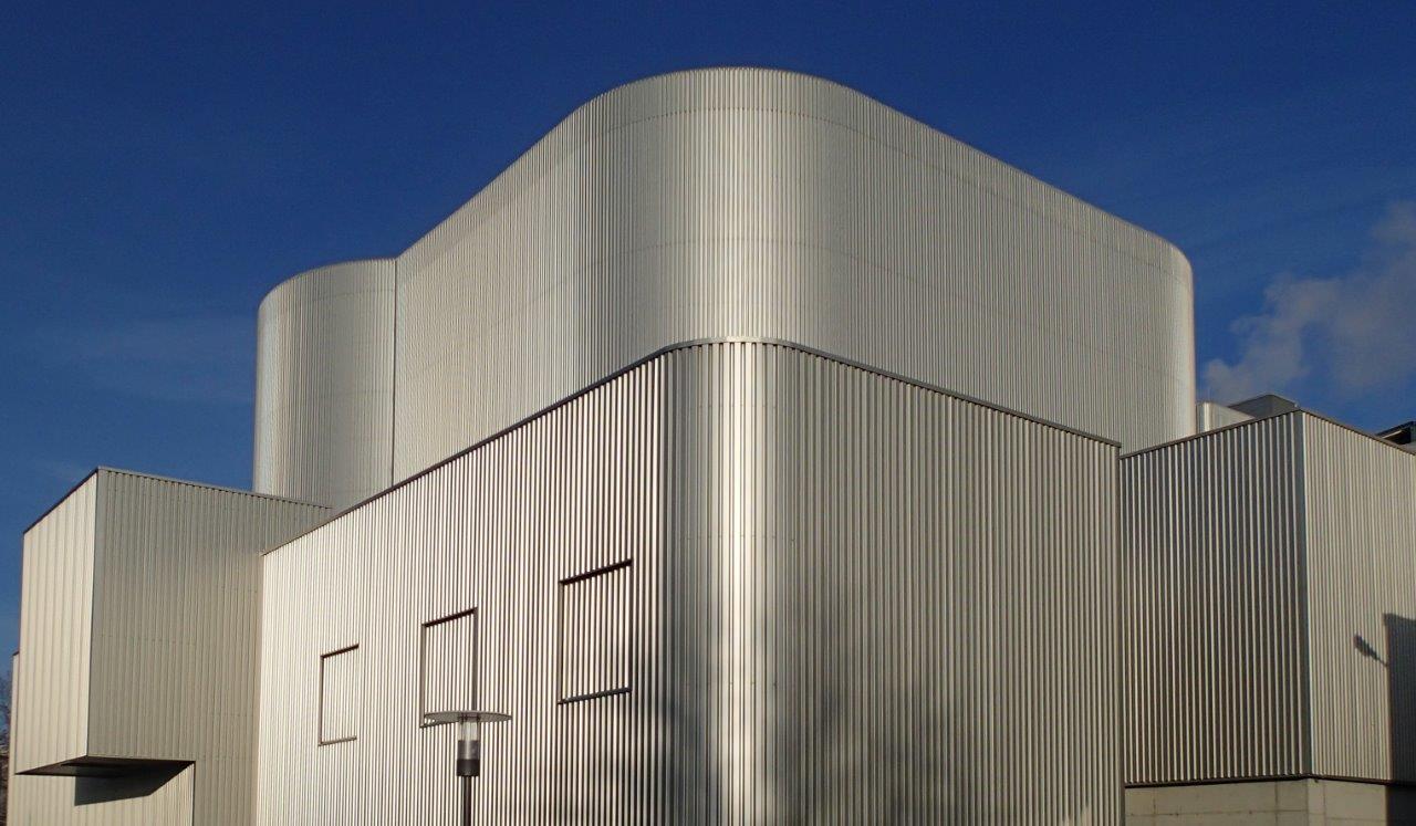 The futuristic-looking exterior is down to the metal facade of a modern combustion plant, shining in the sunlight.