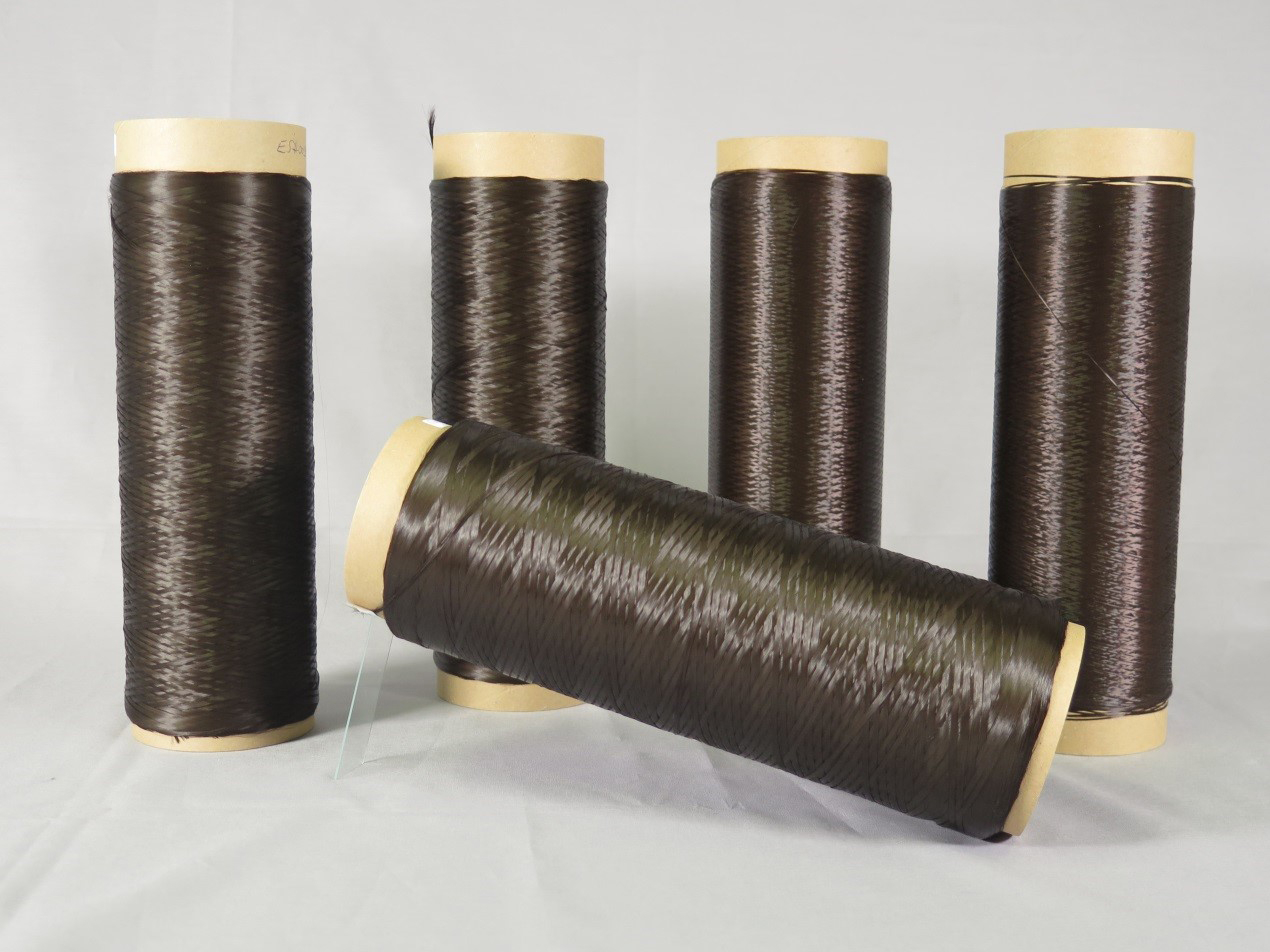 The photo shows brownish fibres that are wrapped around rolls.