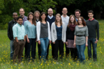 Members of Hölscher's research group standing on a lawn.