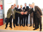 Group of men holding an award