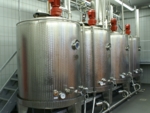 The photo shows a fermentation room with four bioreactors.